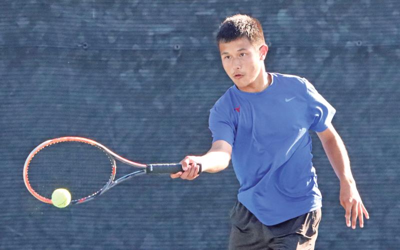 (ARCHIVE PHOTO | THE GRAHAM LEADER) Graham’s Brodey Mills makes contact with a ball during one of the team’s tennis matches. The Steers and Lady Blues faced Canyon Randall in their bi-district match-up Tuesday, Oct. 8, but their season ended with a 19-0 loss.