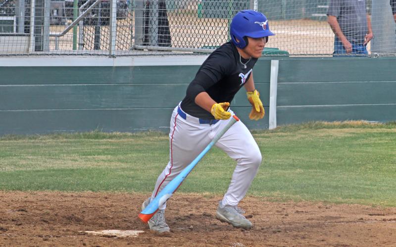 (ALEX KIELAR | BRECKENRIDGE AMERICAN) Mike Garcia takes off for first base in one of the Steers previous matchups. Garcia is a returning starter for the Steers this season. 