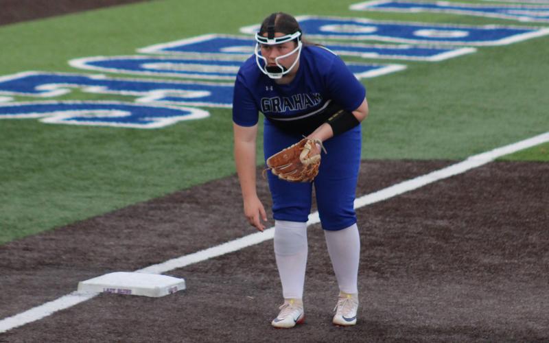 (ALEX HAVARDANSKY | THE GRAHAM LEADER) Hudson Wright covers third base Tuesday, Feb. 17 against the Alvord Lady Bulldogs. Wright put the ball in play to pick up the game’s first run and drove in multiple RBI in the Lady Blues’ 9-1 victory. 