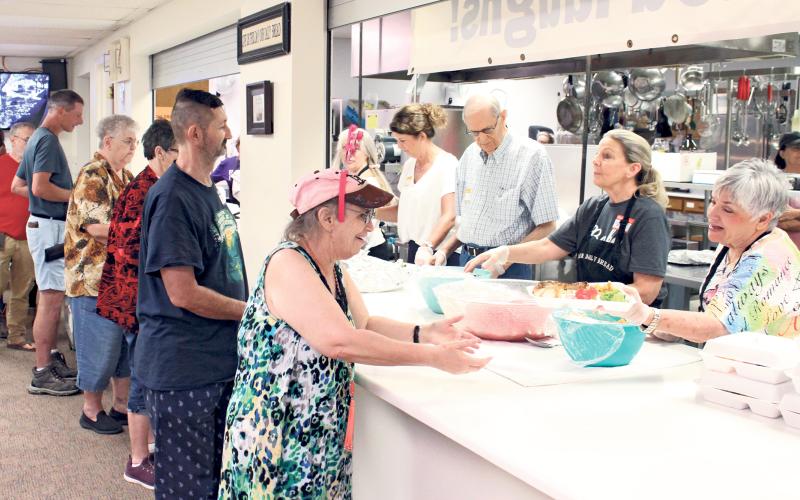 (ARCHIVE PHOTO | THE GRAHAM LEADER) Visitors to the Our Daily Bread program line up for a hot lunch at First United Methodist Church in Graham. The annual program will begin this year Monday, July 7 and run through Friday, Aug. 8.