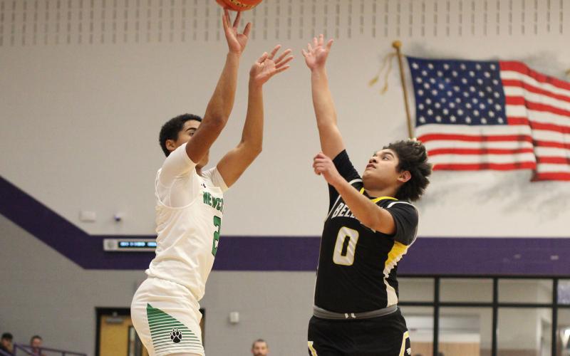 (ALEX HAVARDANSKY | THE GRAHAM LEADER) London Martinez shoots a three pointer Monday, Feb. 23 against the Bellevue Eagles. Martinez led the charge in the second quarter with a pair of triples in the Bobcats’ bi-district matchup. 