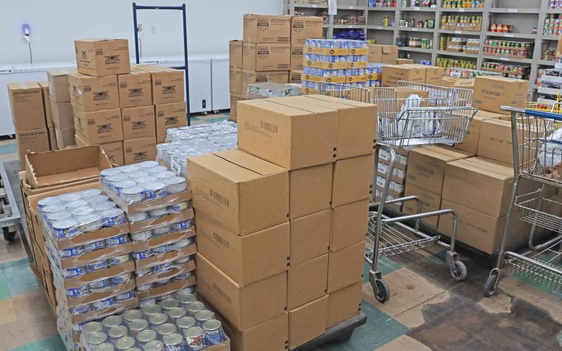 (THOMAS WALLNER | THE GRAHAM LEADER) Food stacked up in boxes at the Graham Crisis Center food pantry. The food pantry service is available to all whose income is below the poverty line. 