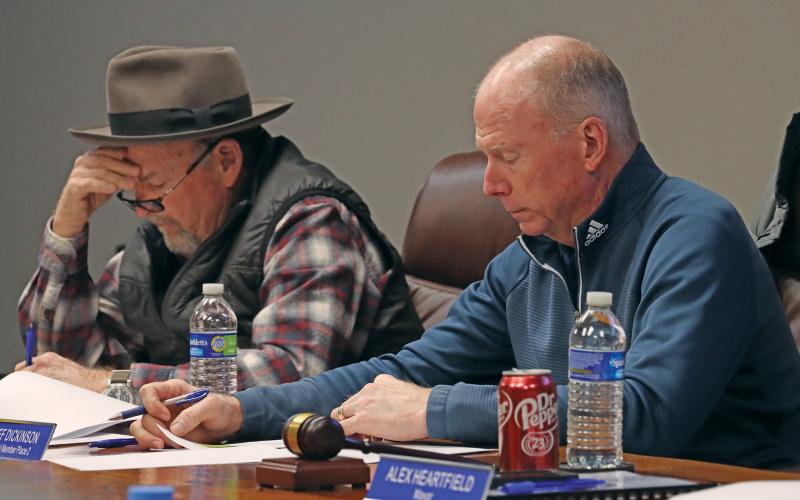(THOMAS WALLNER | THE GRAHAM LEADER) Graham City Council members Jeff Dickinson and Jack Little look over budget documents during a budget meeting held Thursday, Feb. 13. The city will host another budget workshop at 6 p.m. Thursday, May 22.