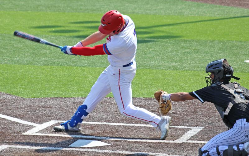 (ARCHIVE PHOTO | THE GRAHAM LEADER) Cooper Corley makes contact with the ball in one of the Steers’ previous matchups. Corley provided the signature moment on offense Saturday, March 14 against the Godley Wildcats with an RBI triple. 