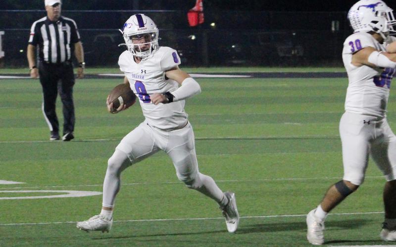 (ALEX HAVARDANSKY | THE GRAHAM LEADER) Jace Gill cuts to the sideline on a rushing attempt Thursday, Oct. 23, against the Mineral Wells Rams. Gill has been the offensive leader for the Steers all season.