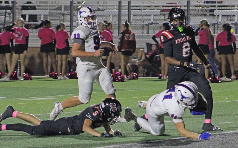(ALEX HAVARDANSKY | THE GRAHAM LEADER) Dylan Cox lunges into the endzone for a touchdown Thursday, Oct. 23, against the Mineral Wells Rams. Cox had a big night on the ground with three rushing touchdowns. 