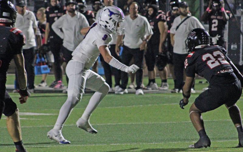 (ALEX HAVARDANSKY | THE GRAHAM LEADER) Bryce Martin breaks away from defenders after making a catch Thursday, Oct. 23, against the Mineral Wells Rams. Martin has been a solid piece in the receiving game for the Steers all season. 