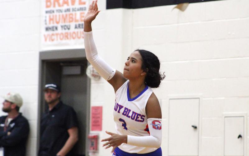 (ALEX HAVARDANKSY | THE GRAHAM LEADER) Izzy Alejo hits a ball on a serve attempt Friday, Oct. 24, against the Mineral Wells Lady Rams. Alejo has consistently been a spark plug defensively and at the service line for the Lady Blues this year.