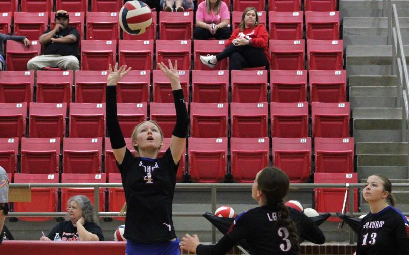 (ALEX HAVARDANKSY | THE GRAHAM LEADER) Paizlee Evans sets a ball up for her Lady Blues teammates Friday, Oct. 24, against the Mineral Wells Lady Rams. The Lady Blues showed steady growth this year and will lead the program into the future. 