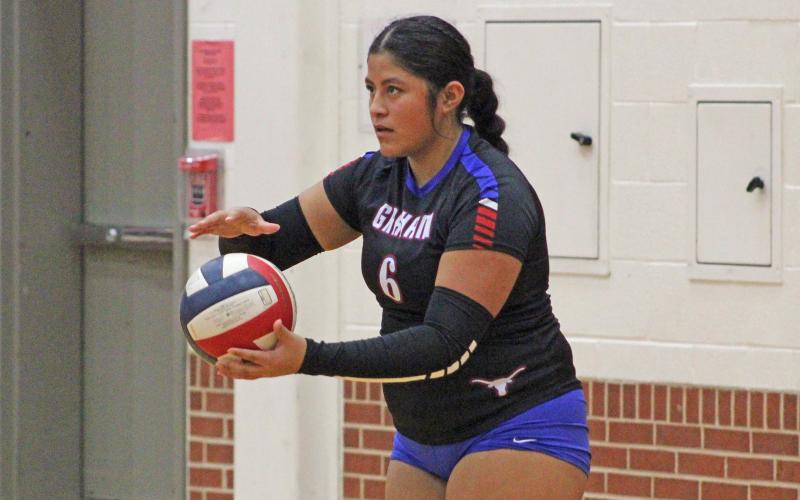 (ALEX HAVARDANKSY | THE GRAHAM LEADER) Alexis Aguirre prepares to throw the ball up for a serve attempt Friday, Oct. 24, against the Mineral Wells Lady Rams. This was the Lady Blues final game of the regular season.