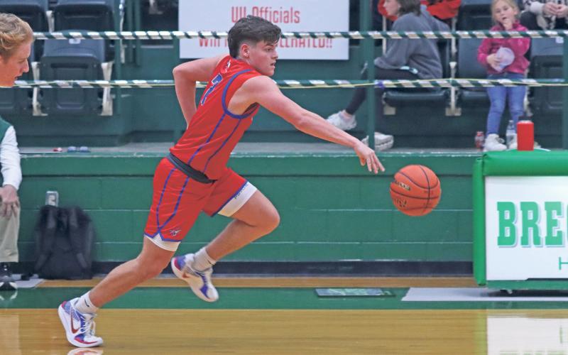 (TC GORDON | THE GRAHAM LEADER) Graham’s Bryce Martin pushes the ball ahead of him after making a steal and transitioning to offense during the team’s game against Breckenridge last week.