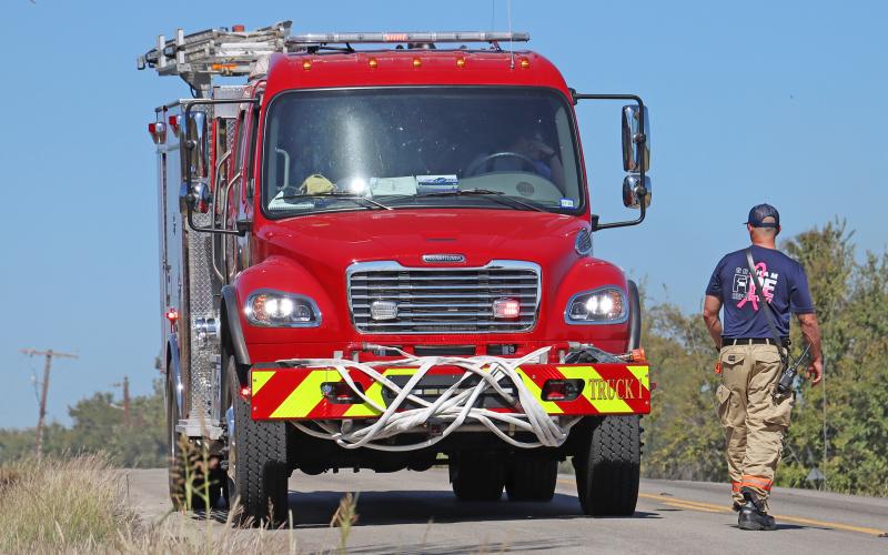 (THOMAS WALLNER | THE GRAHAM LEADER) Graham Fire Department responds to a fire on Red Top Road that broke out Monday, Oct. 20. The department will be evaluating the acceptance of a grant awarded from the Rural Volunteer Fire Department Assistance Program with Texas A&M Forest Service.