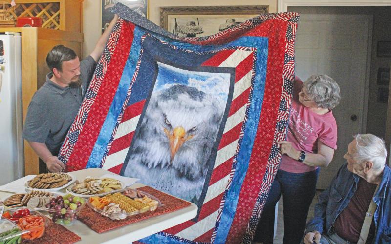(ALEX HAVARDANSKY | THE GRAHAM LEADER) Young County veteran James Workman was presented a Quilt of Valor for his 23 year of military service in the U.S. Navy. Workman was presented the quilt Wedensday, Oct. 29 at his home.