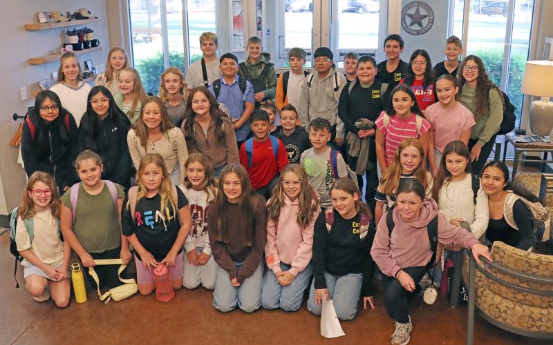 (THOMAS WALLNER | THE GRAHAM LEADER) Graham Junior High School students that are participating in the Graham Chamber of Commerce Hot Chocolicious competition this year. The students visited the chamber office Wednesday, Oct. 22 to receive a loan and work on marketing their hot chocolate businesses.