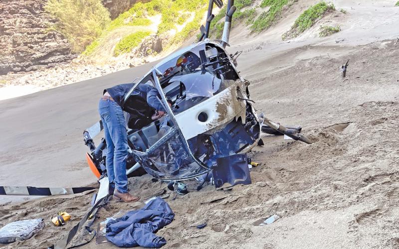(CONTRIBUTED PHOTO | SHANA WOLFE) A helicopter which made a forced landing Tuesday, Feb. 27 off the shores of Kauai, Hawaii. Two of the four passengers in the helicopter were from Graham.