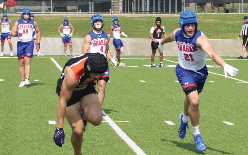 (ALEX HAVARDANSKY | THE GRAHAM LEADER) Thomason Burkett defends a pass Saturday, May 17 against the Springtown Porcupines. Burkett made the most of his first chance to shine on both ends of the field during the opener of this offseason program.