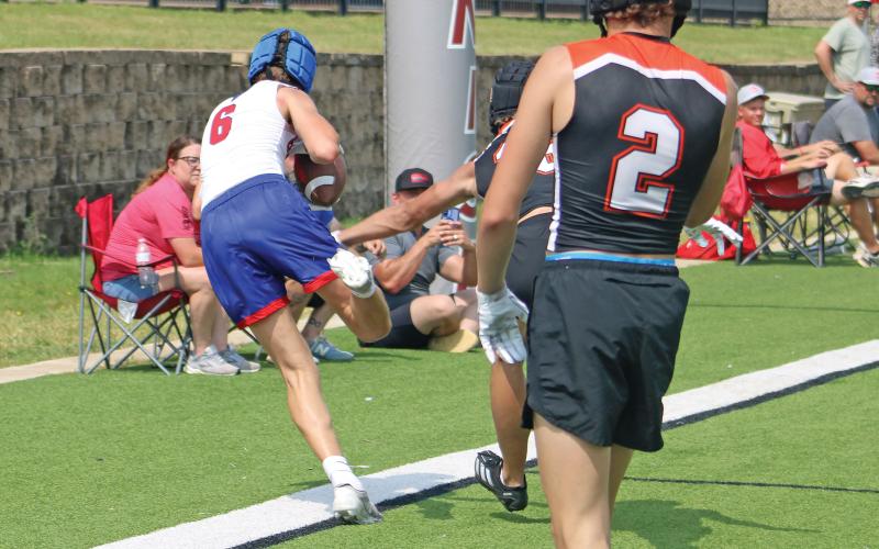 (ALEX HAVARDANSKY | THE GRAHAM LEADER) Walker Bennett makes a toe tap catch in the back of the endzone for Graham’s first touchdown Saturday, May 17 against the Springtown Porcupines. Bennett, alongside receivers like Brodie and Bryce Martin, had standout performances across all games making big plays.