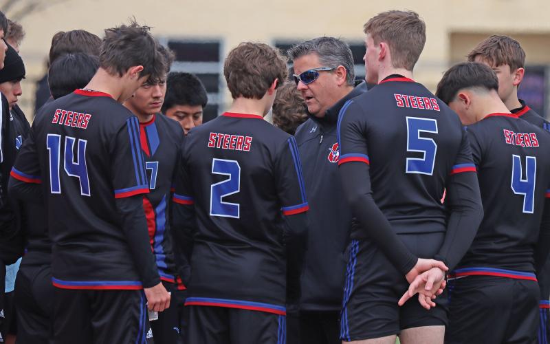 (THOMAS WALLNER | THE GRAHAM LEADER) Steers head coach Tim Wankowicz speaks with the team during their match against the Bridgeport Bulls at home Friday, Feb. 21. The Steers rallied but ultimately fell in a penalty shootout.