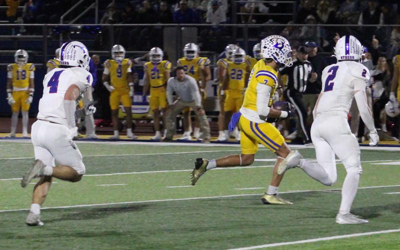 (ALEX HAVARDANSKY | THE GRAHAM LEADER) Macrae Menard, 2, and Isaiah Flores, 4, chase down a Brock receiver Friday, Oct. 31 against the Eagles. The defense was solid all around, grabbing multiple takeaways on the night.