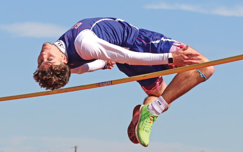 (KYLIE BAILEY | THE GRAHAM LEADER) Jordan Alexander of the varsity Steers team makes a jump in the high jump portion of the Mineral Wells Ram Relays event held Saturday, Feb. 22. 