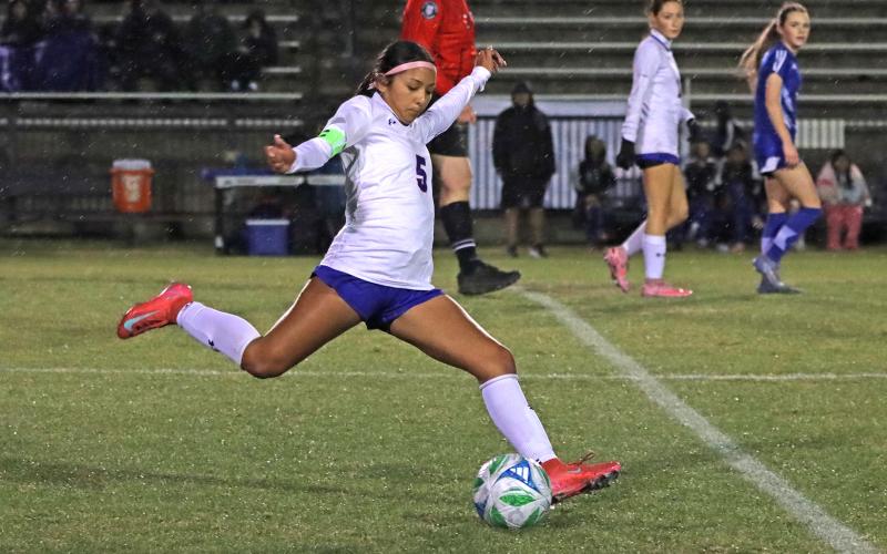 (KYLIE BAILEY | THE GRAHAM LEADER) Mai Bara fires a shot Tuesday, Feb. 10 against the Decatur Lady Eagles. The offense stayed focused in the Lady Blues’ 5-4 win.