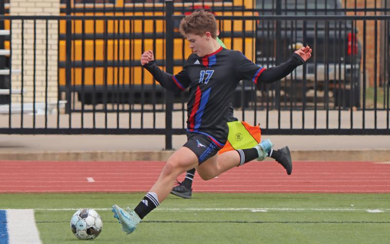 (THOMAS WALLNER | THE GRAHAM LEADER) Cooper Wilde runs up to kick a ball during one of the Steers’ 2024 matches. The Steers will have many returning players from last season’s roster, like Wilde, which head coach Tim Wankowicz said was good for continuity going into this season. 
