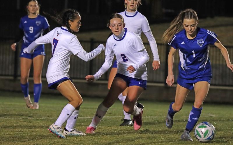 (KYLIE BAILEY | THE GRAHAM LEADER) Rylee Besack chases after a ball Tuesday, Feb. 10 against the Decatur Lady Eagles. The defense was once again top notch in the Lady Blues’ 5-4 win. 