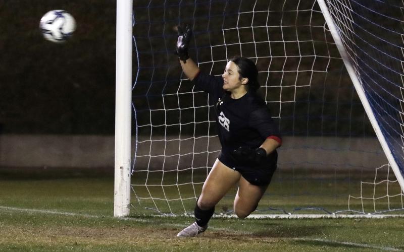 (KYLIE BAILEY | THE GRAHAM LEADER) Taylor Lauster dives for a save Tuesday, Feb. 10 against the Decatur Lady Eagles. Lauster saved three of five shots in the shootout against Decatur. 