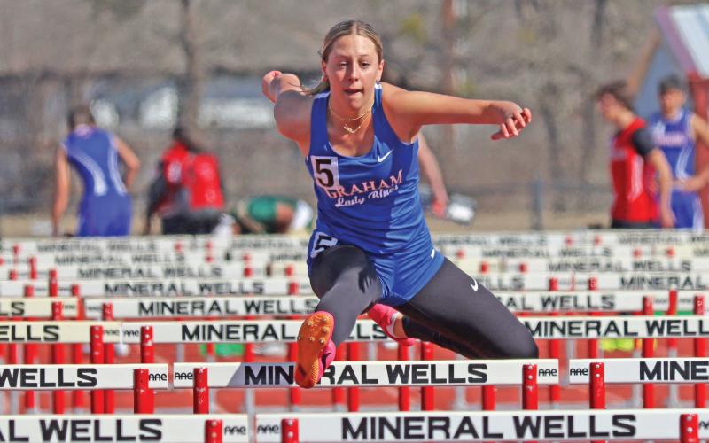 (ARCHIVE PHOTO | THE GRAHAM LEADER) Lady Blues senior Braylee Mayes has grown in the track and field program at Graham High School. Mayes has shown consistency with hurdles for four years and has seen the progress pay off with her achieving top marks in the last three competitions. 