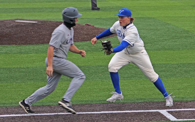 (ALEX HAVARDANSKY | THE GRAHAM LEADER) First baseman Cotter Johnson attempting to make a tag out up the first base line for Graham during their matchup Friday, April 4 against Brownwood. 