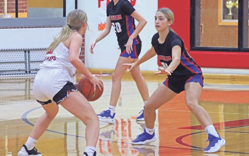 (ARCHIVE PHOTO | THE GRAHAM LEADER) The Lady Blues’ Ava Street (11) keeps her eye on the player in front of her during a game earlier in the season. The Lady Blues came out on top in a 54-51 victory Tuesday, Dec. 17 against San Angelo Central.