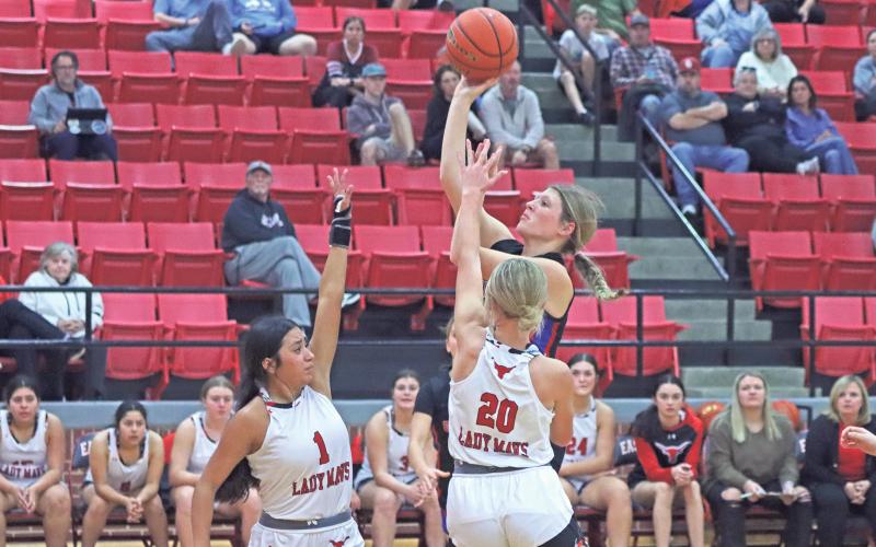 (ARCHIVE PHOTO | THE GRAHAM LEADER) Briley Randall puts up a shot over the arms of a couple of Eastland defenders during a game earlier in the season. Randall led in scoring this week in the final non-district game Monday, Dec. 30 against San Angelo.