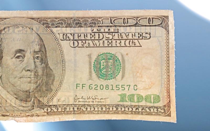 (THOMAS WALLNER | THE GRAHAM LEADER) The counterfeit bill shown was used to make a purchase in Graham this week. Looking into the sunlight with the $100 bill shows Alexander Hamilton, which is only present on $10 bills. 
