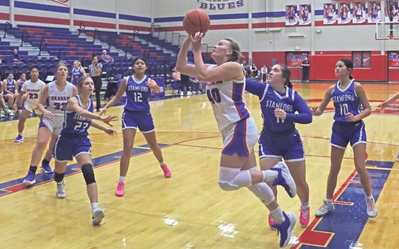 (TC GORDON | THE GRAHAM LEADER) Graham’s Addyson Weaver puts up a close shot at the beginning of the game Tuesday, Nov. 19 during the Lady Blues’ 45-35 win over Stamford.