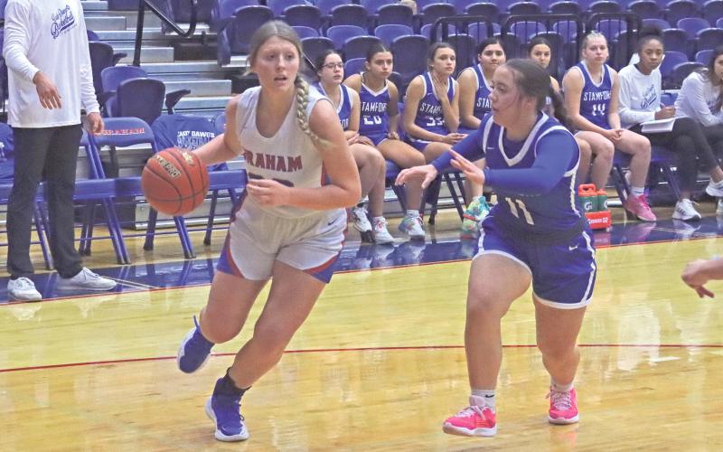 (TC GORDON | THE GRAHAM LEADER) The Lady Blues’ Briley Randall drives down the baseline toward the basket as she looks for a shot Tuesday, Nov. 19 in Graham’s 45-35 win over Stamford.