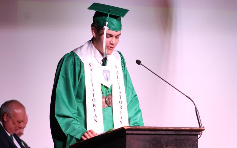 (ALEX HAVARDANSKY | THE GRAHAM LEADER) Benjamin Burk opens the night speaking as class salutatorian Friday, May 23 at the Newcastle High School graduation ceremony. Burk gave many thanks to his loved ones while also pushing his fellow graduates to succeed in their next chapters in life.
