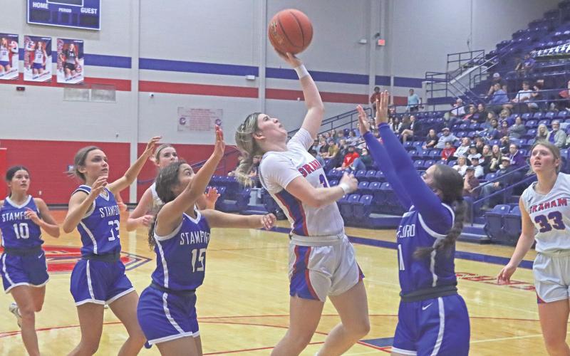 (TC GORDON | THE GRAHAM LEADER) Graham’s Mayci Ryans finishes a fastbreak transition with a layup for two points Tuesday, Nov. 19 in the team’s 45-35 win against Stamford.