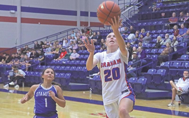 The Lady Blues’ Katie McGehee rolls a layup off her fingers for points Tuesday, Nov. 19 in Graham’s 45-35 win against the Stamford Lady Bulldogs.