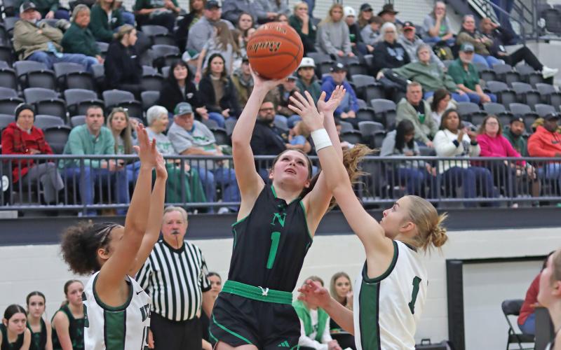 (THOMAS WALLNER | THE GRAHAM LEADER) Camren Mallory attempts a shot near the basket to put points on the board for the Ladycats and close the scoring gap between the two teams. Newcastle fell to Neches in the regional final matchup Friday, Feb. 21.