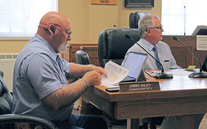 (TC GORDON | THE GRAHAM LEADER) Young County Commissioners Jimmy Wiley (left) and Stacey Rogers (right) listen to a presentation during the commissioners court meeting Monday, Aug. 19. The county will hold public hearings and potentially vote on the fiscal year 2025 budget and tax rate at 9:30 a.m. Monday, Aug. 26.
