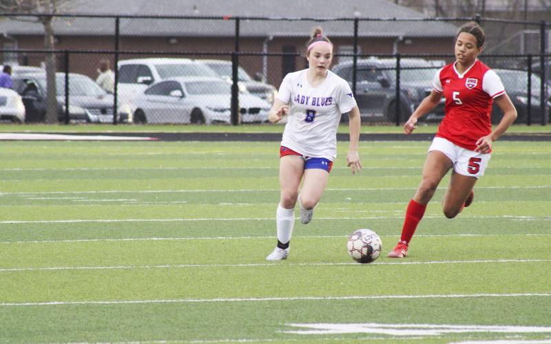 (MIKE WILLIAMS | THE GRAHAM LEADER) Lady Blues defender Kinsley Amburn moves the ball upfield during the second half of the Lady Blues 2-0 win over Mineral Wells Monday evening.