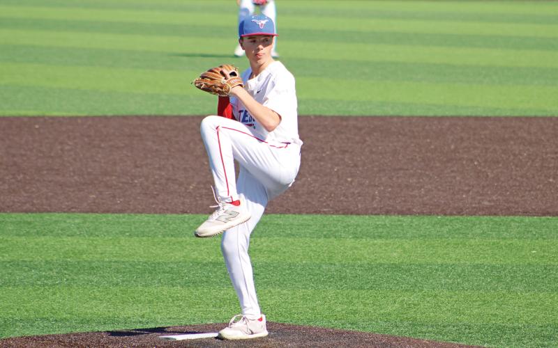 (ALEX HAVARDANSKY | THE GRAHAM LEADER) Ayden McDougal takes the mound in the first inning for the Steers in their matchup Tuesday, April 8 against Mineral Wells. 