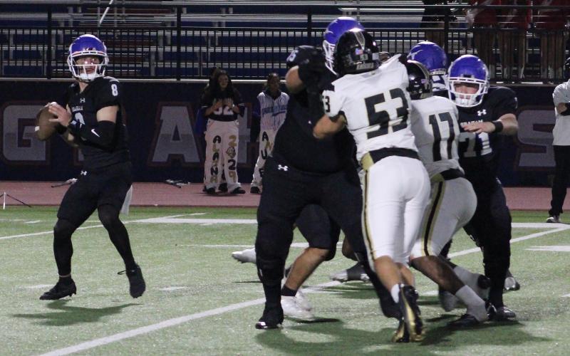 (ALEX HAVARDANSKY | THE GRAHAM LEADER) Jace Gill drops back to pass Friday, Nov. 7 against Eagle Mountain. Gill led a game winning drive in the fourth quarter to help the Steers pick up the victory. 