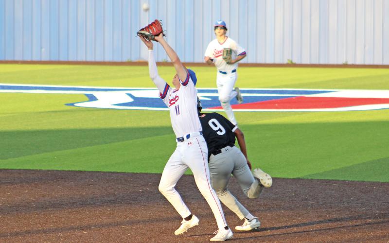 (ALEX HAVARDANSKY | THE GRAHAM LEADER) Tanner Hurford catches an infield pop up for an out Tuesday, April 8. Hurford is the starting second baseman for the Steers.