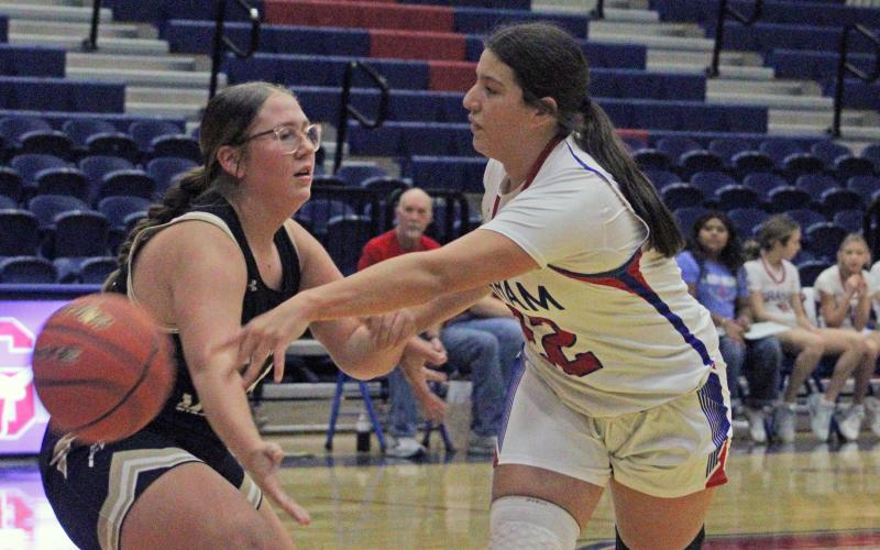(ALEX HAVARDANSKY | THE GRAHAM LEADER) Maddyx Marin looks to pass the ball to one of her teammates in the Lady Blues season opener. Marin hit a pair of jumpshots and a free throw in the Lady Blues win Saturday, Nov. 15 over the Lady Leopards.