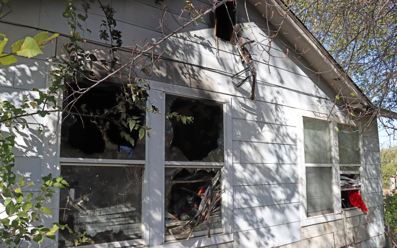 (THOMAS WALLNER | THE GRAHAM LEADER) Windows on the side of a home on Privado Street in Graham where a fire occurred Monday, Nov. 10. 