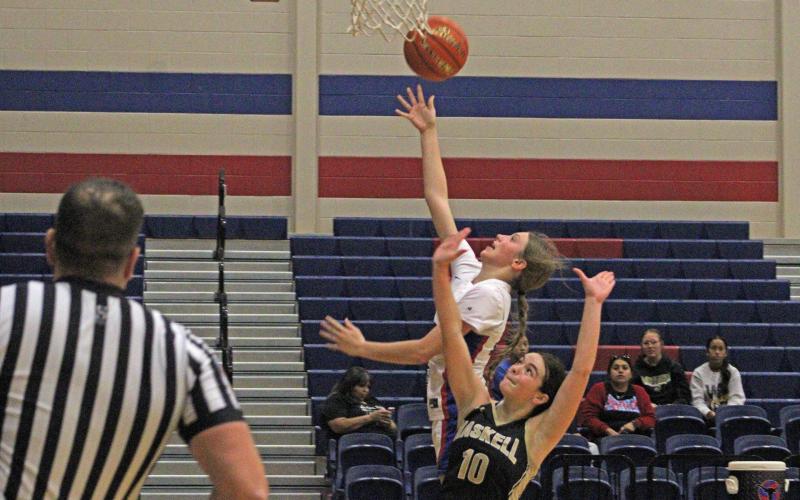 (ALEX HAVARDANKSY | THE GRAHAM LEADER) Katy McGehee puts the ball up on the back board for a layup attempt Tuesday, Nov. 11 against the Haskell Lady Indians. McGehee will serve as one of the veteran leaders of this team. 