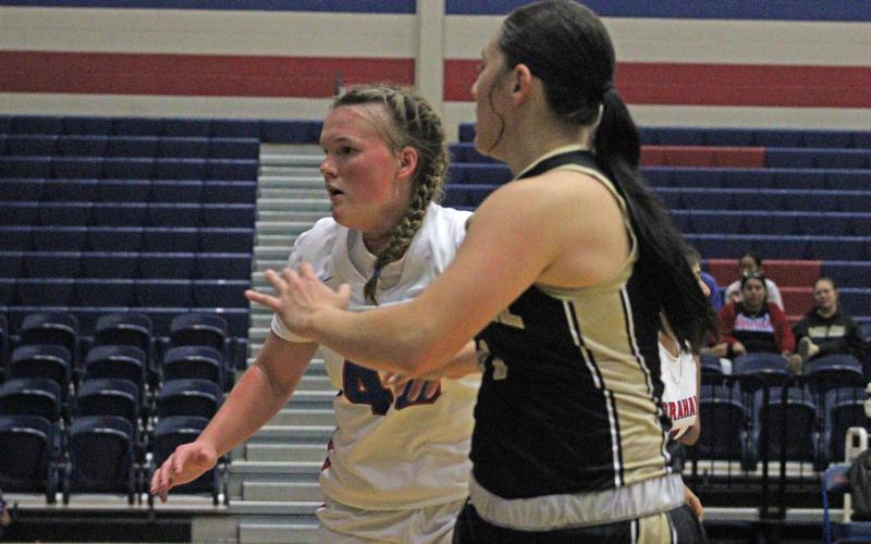 (ALEX HAVARDANKSY | THE GRAHAM LEADER) Addyson Weaver plays man-to-man defense on Lady Indians players in their matchup Tuesday, Nov. 11. Weaver will be a strong front court presence for the Lady Blues this season.