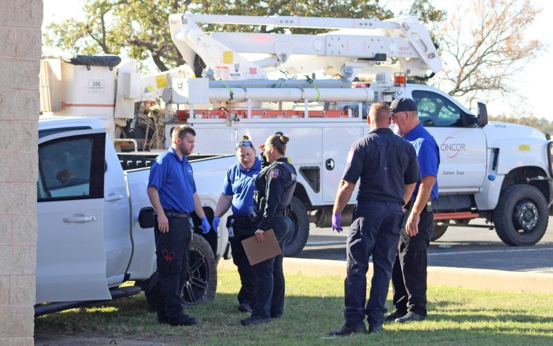 (ALEX HAVARDANKSY | THE GRAHAM LEADER) Members of Graham Police Department, Graham Fire Department and Graham EMS look over the scene of a wreck that occurred Wednesday, Nov. 12 in the 1300 block of Hwy. 16 South.