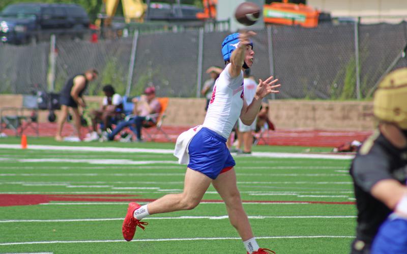 (ALEX HAVARDANSKY | THE GRAHAM LEADER) Jace Gill throws a pass Saturday, May 31 in the second of Graham’s pool matches for seven on seven football. While Gill did throw an interception on the day, he still was very sharp finding all kinds of receivers for big plays and scores on the day.
